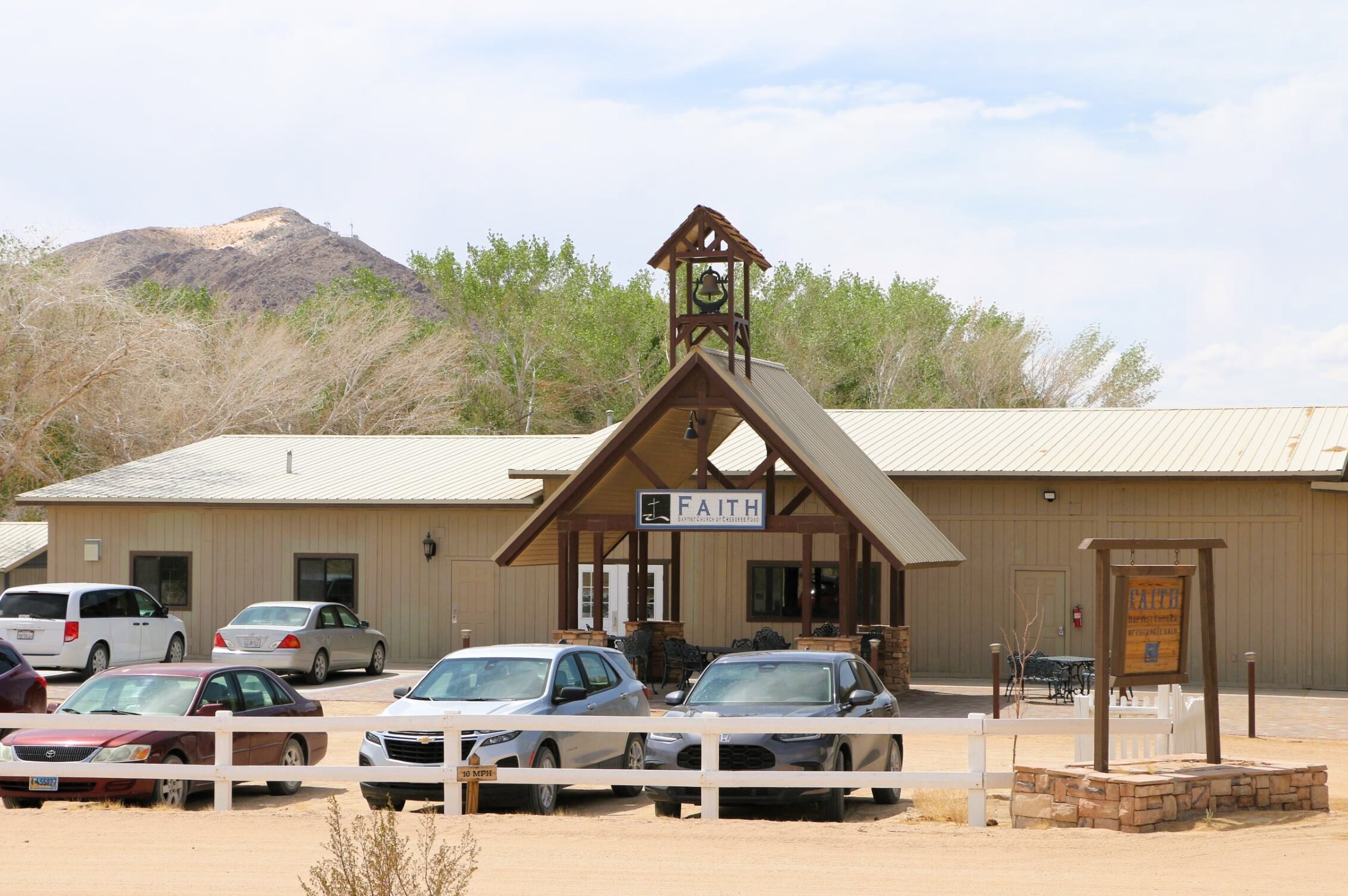 Church Exterior w Cars & Mountain